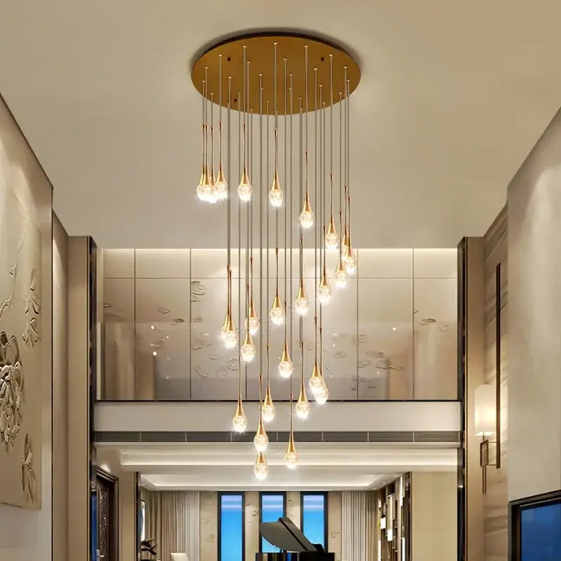 Modern golden crystal led staircase chandelier with teardrop-shaped pendants for lobby decorbites crystal led lighting