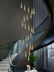 Modern golden crystal pendant chandelier with teardrop lights for living room decor featuring decorbites crystal pendant design