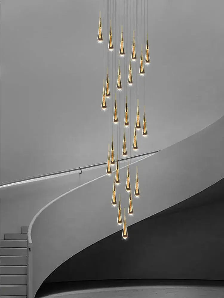Modern golden crystal pendant chandelier with cascading teardrop lights by decorbites crystal pendant for living room decor
