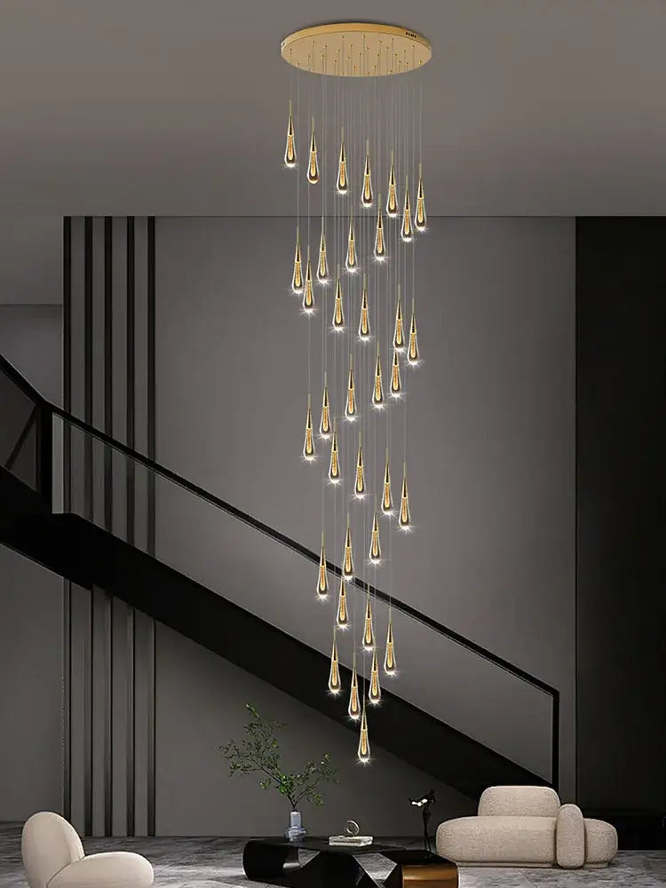 A modern decorbites crystal pendant chandelier with golden teardrop lights and a circular wooden ceiling mount