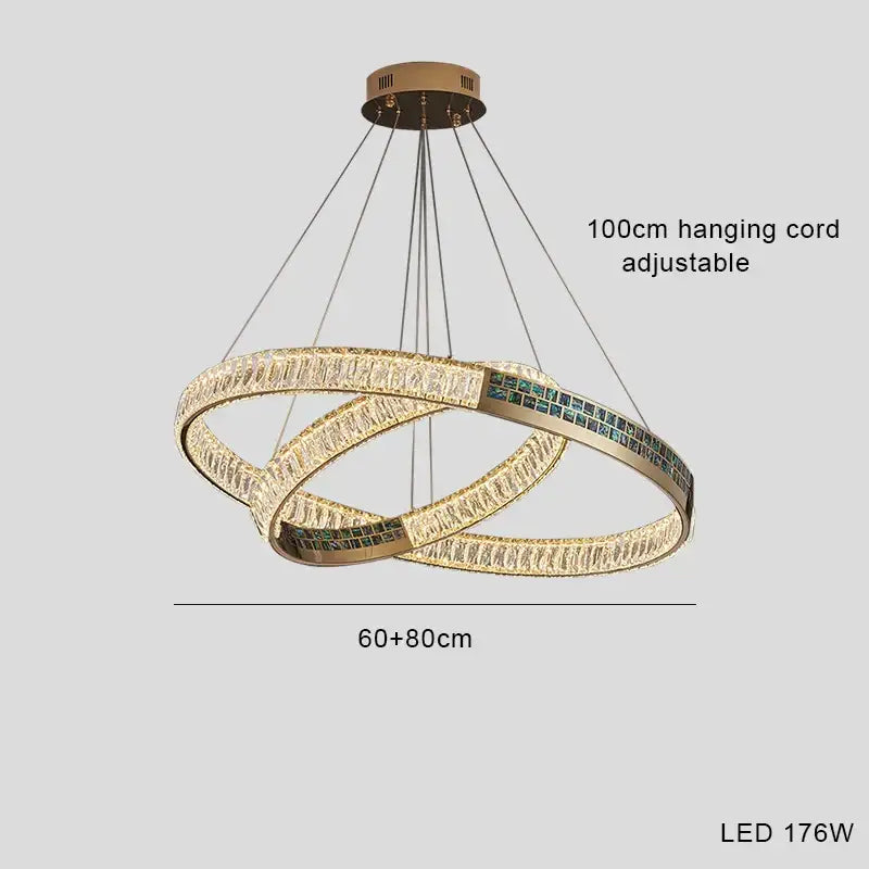 Modern golden crystal ring ceiling chandelier with two interlocking led rings and green crystal accents by decorbites