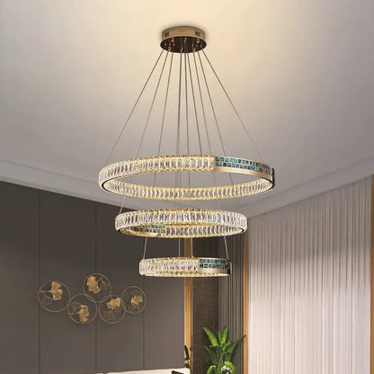 Modern golden crystal ring ceiling chandelier with gold metal frames teal mosaic tiles and cascading clear crystals decorbites crystal ring