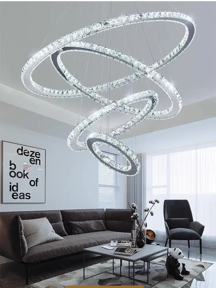 A modern golden crystal rings pendant chandelier with interlocking crystal rings for living room decorbites crystal rings