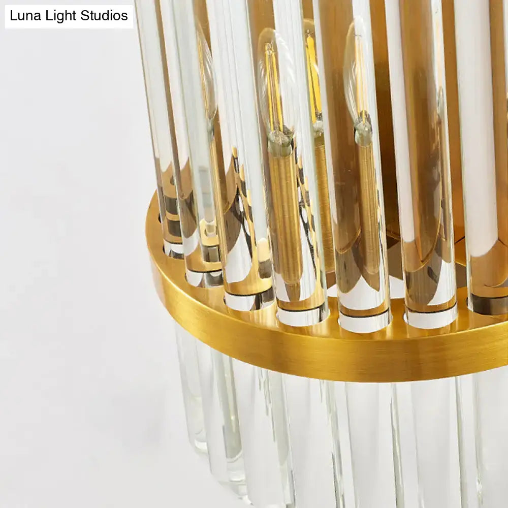 Modern golden wall sconce with crystal shade featuring gold-toned frame clear crystal rods and frosted glass accents