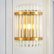 Modern golden crystal shade wall sconce with clear crystal rods and fluted glass accents for bedroom wall lamp