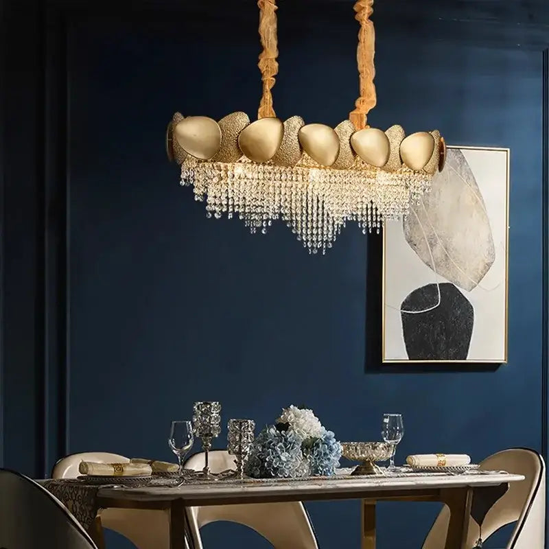 Modern golden decorbites crystal chandelier with polished egg-shaped orbs and cascading crystal droplets for living room