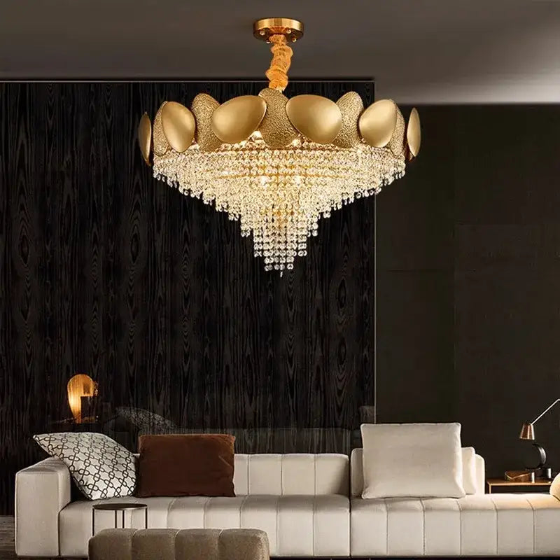 Modern golden decorbites crystal chandelier with ornate metallic frame and cascading crystal droplets for living room