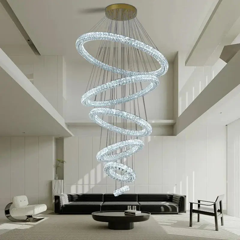 A modern golden decorbites crystal ring chandelier with multiple glowing crystal rings for living room lighting