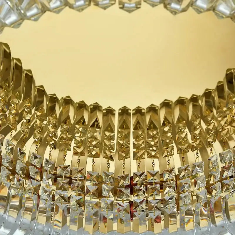 Modern golden decorbites crystal ring ceiling lamp with gold-toned geometric metal arms and faceted crystal droplets