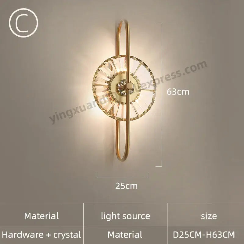 Modern golden decorbites crystal wall light featuring a gold-toned circular crystal design and curved metal arms for bedroom