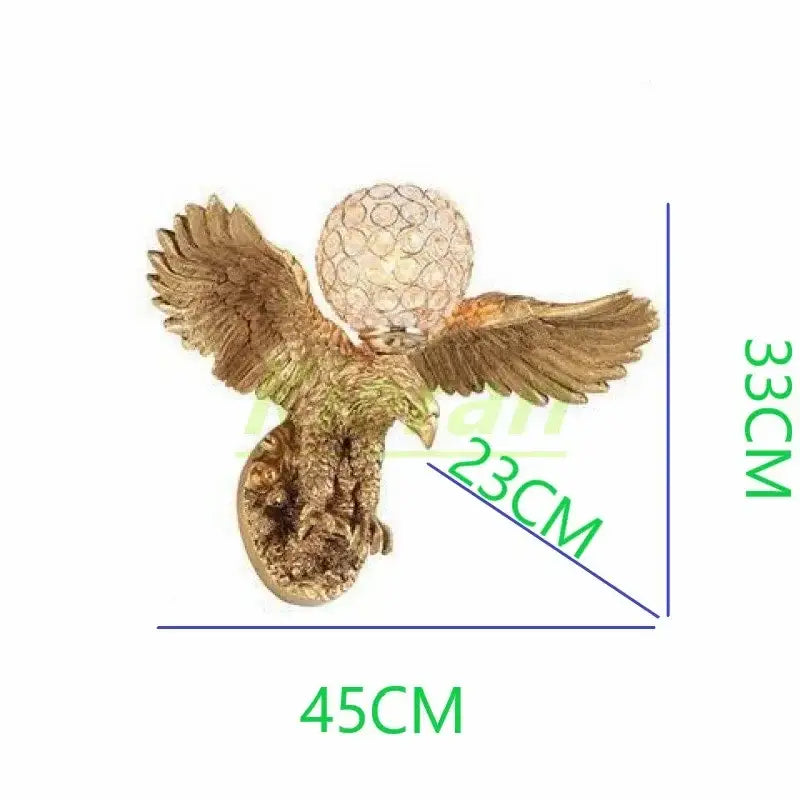 Modern golden eagle crystal led wall lamp with intricate feathers and textured crystal globe for bedroom living room