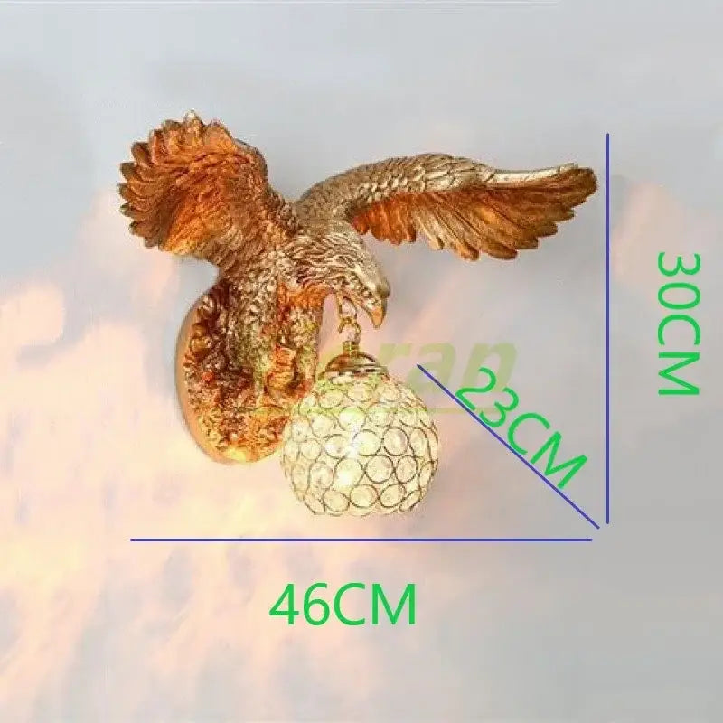 Modern golden eagle crystal led wall lamp with detailed feathered wings and a crystal globe light fixture for living room