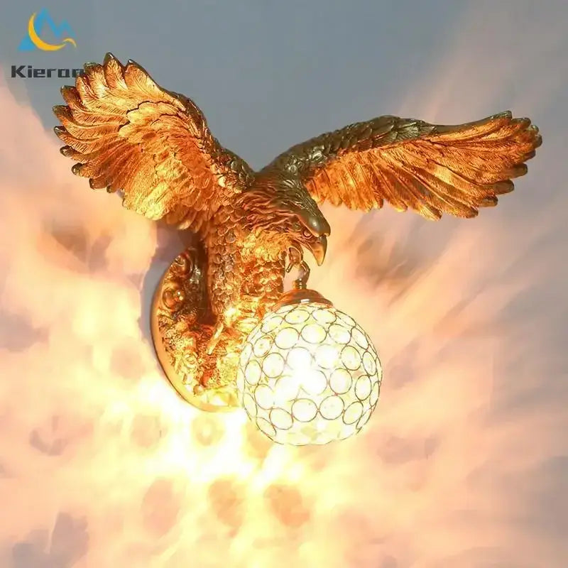 Modern golden eagle crystal led wall lamp with detailed feather texture and crystal globe base for bedroom living room