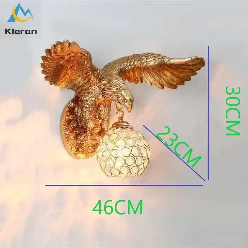 Modern golden eagle crystal led wall lamp featuring detailed feathering and a crystal-encrusted globe for living room use