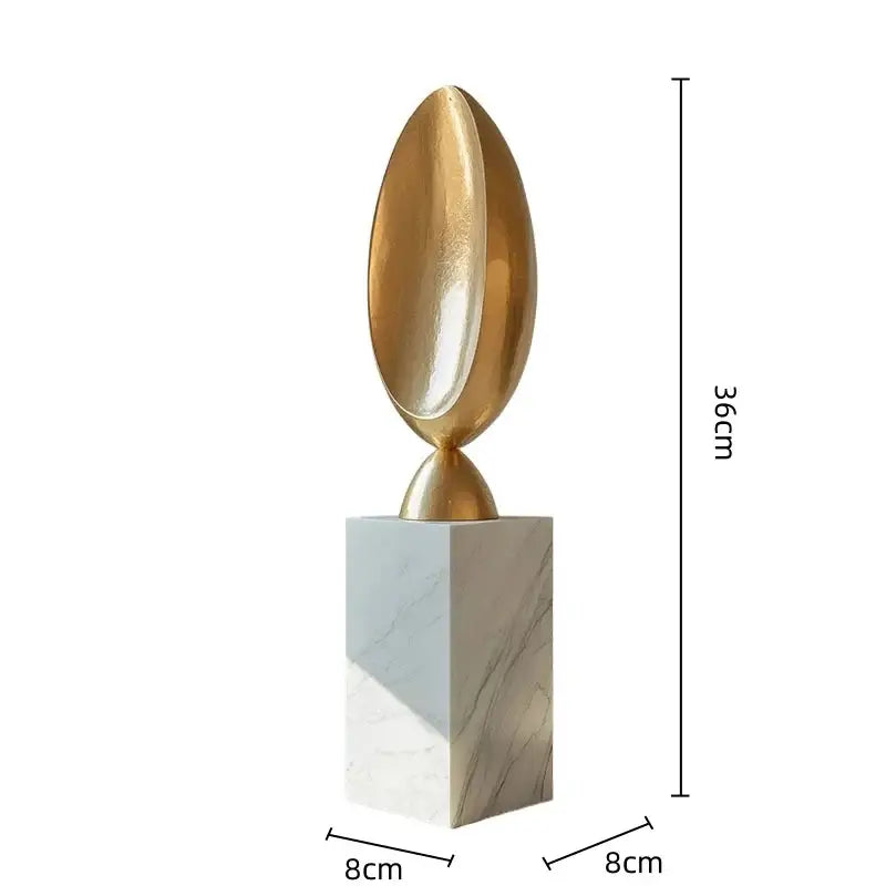Golden geometric animal egg-shaped sculpture on white marble pedestal modern decorbites living room decor