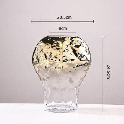 A modern handcrafted golden geometric glass vase with hammered texture and gold black decorbites living room decor