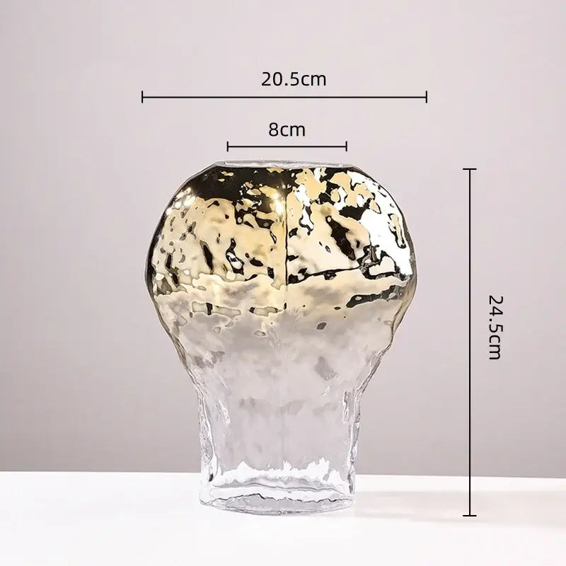 A modern handcrafted golden geometric glass vase with hammered texture and gold black decorbites living room decor
