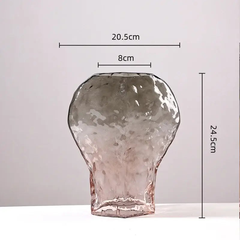 A translucent textured glass vase with hammered finish and subtle pink hue in decorbites golden geometric glass set