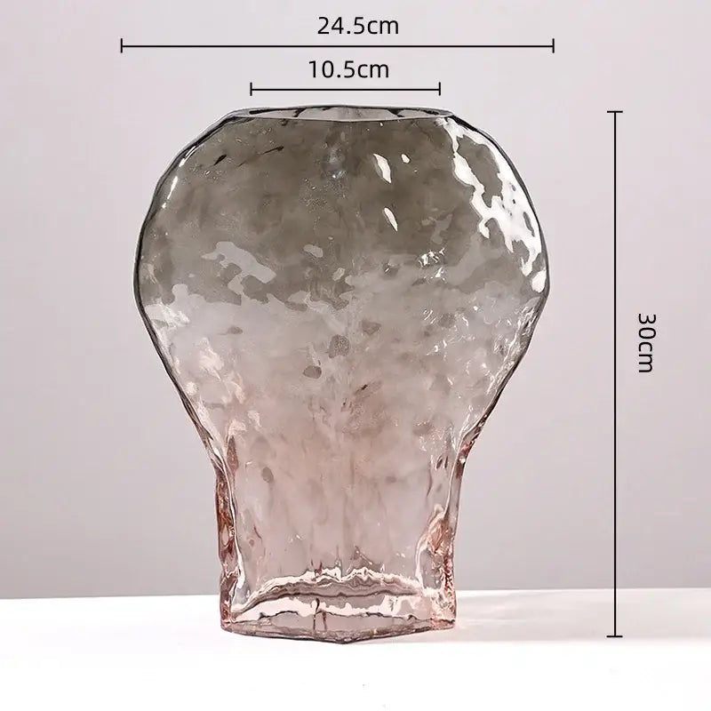 A translucent gray glass vase with hammered texture and flared base for decorbites golden geometric glass decor
