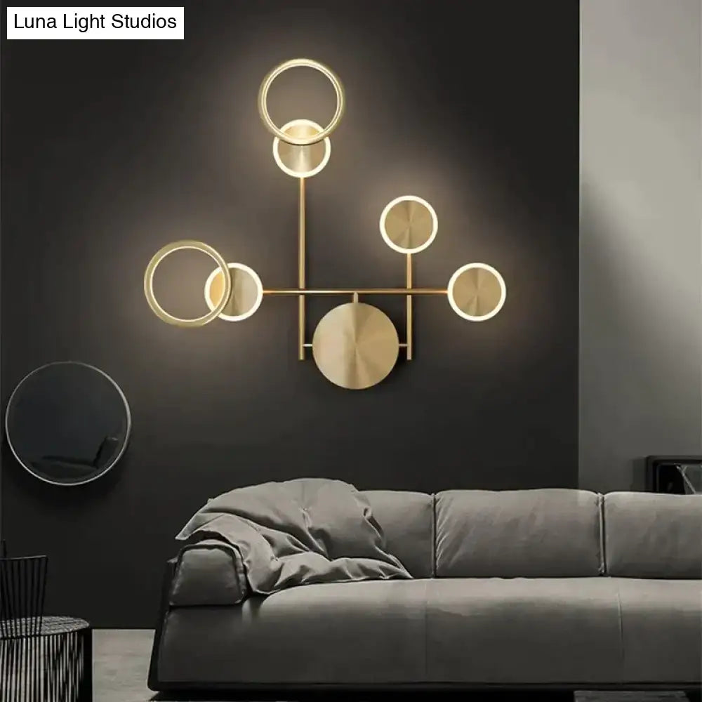 Modern golden geometric led wall lamp with interconnected circles in gold tone for living room wall lamp decor