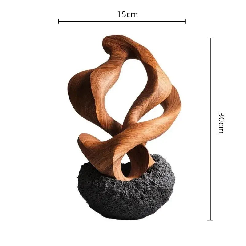 Modern golden geometric resin sculpture with flowing curves in golden finish on textured black base for home decor