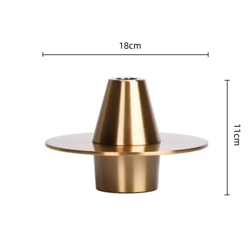 Brass candle holder with a conical top and circular base in decorbites golden geometry metal handicraft style for modern decor