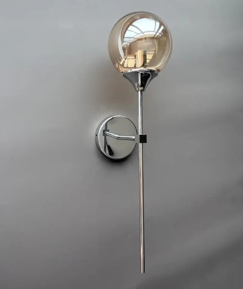 Modern golden glass ball wall lamp with chrome-finished spherical globe and circular mounting plate for decorbites golden glass