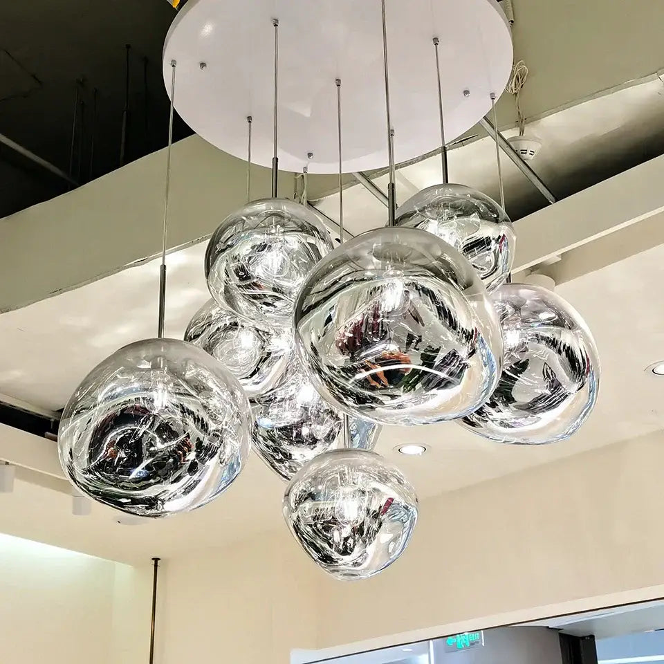 Modern chrome-finished glass globe pendant light with sleek reflective surface in decorbites glass lava pendant for dining room