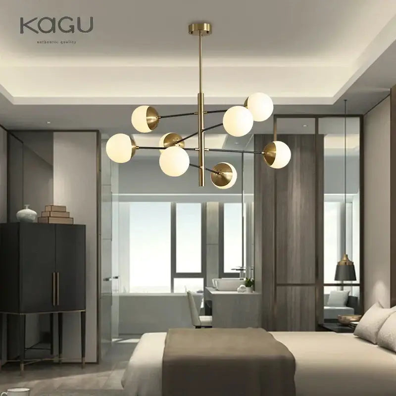 Modern brass-finished chandelier with spherical frosted glass globes for dining room decorbites golden glass magic bean
