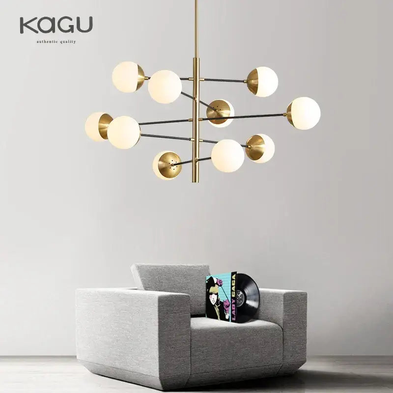 Modern golden glass magic bean chandelier with brass and black metal frame and frosted glass globe bulbs for dining room decorbites golden glass