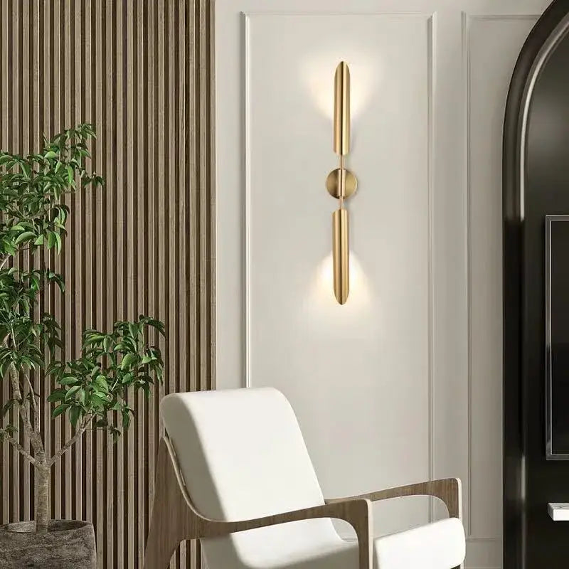Modern golden inclined tube wall lamp featuring a gold-toned minimalist design with sleek vertical bars for luxury decorbites golden inclined living room use