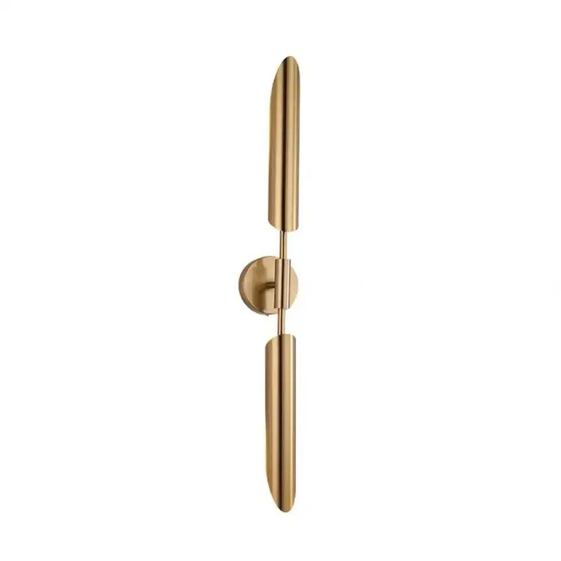 Modern golden inclined tube wall lamp with sleek gold-toned cylindrical arms and minimalist circular base for decorbites golden inclined style