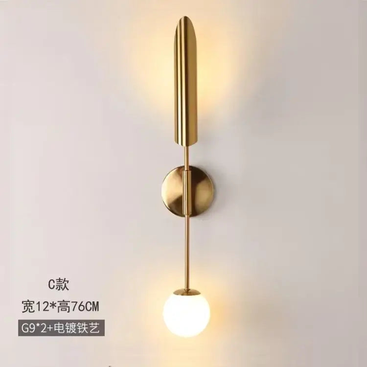 Modern golden inclined tube wall lamp with gold-toned stem and frosted glass bulb for living room decorbites golden inclined