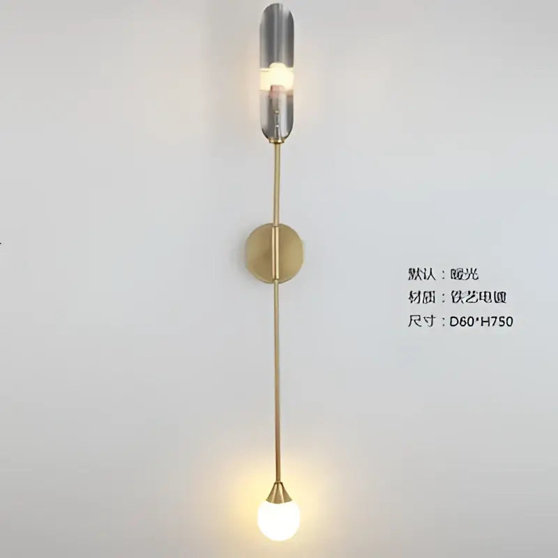 A sleek modern wall lamp with brass finish and two inclined tube lights from decorbites golden inclined series