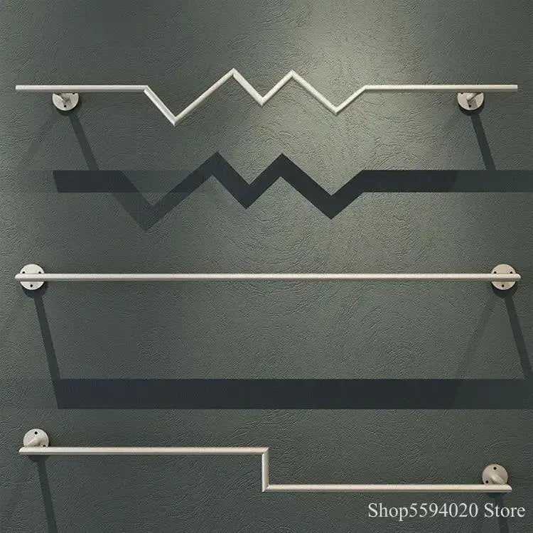 Three sleek modern metal towel racks in brushed silver with angular design perfect for decorbites golden iron ladder shelf