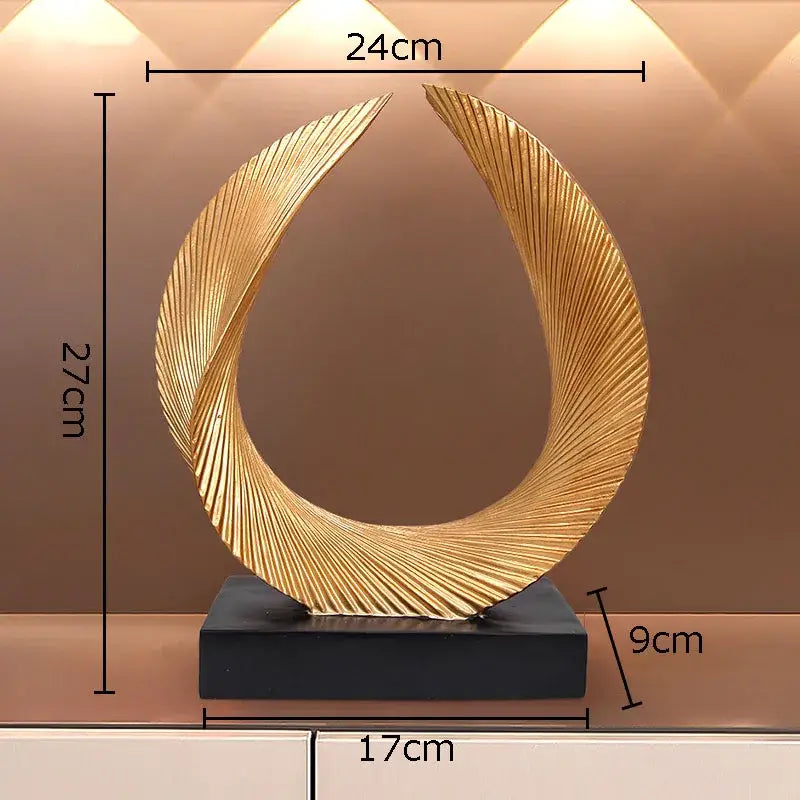 Modern golden knot sculpture featuring an intricately ribbed swirling design on a black base for desk decorbites golden knot