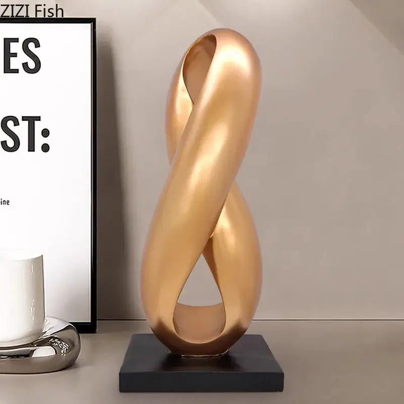 Modern golden knot sculpture with sleek intertwined loop design on black base ideal as knot sculpture desk decorbites ornament