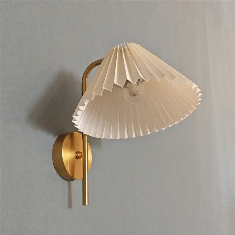 Modern golden led reading wall lamp with gold-toned metal and cream pleated paper shade for minimalist decorbites golden led use