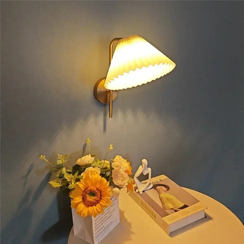 Warm-toned brass wall lamp with pleated glowing lampshade for modern golden led reading bedroom decorbites golden led spotlight