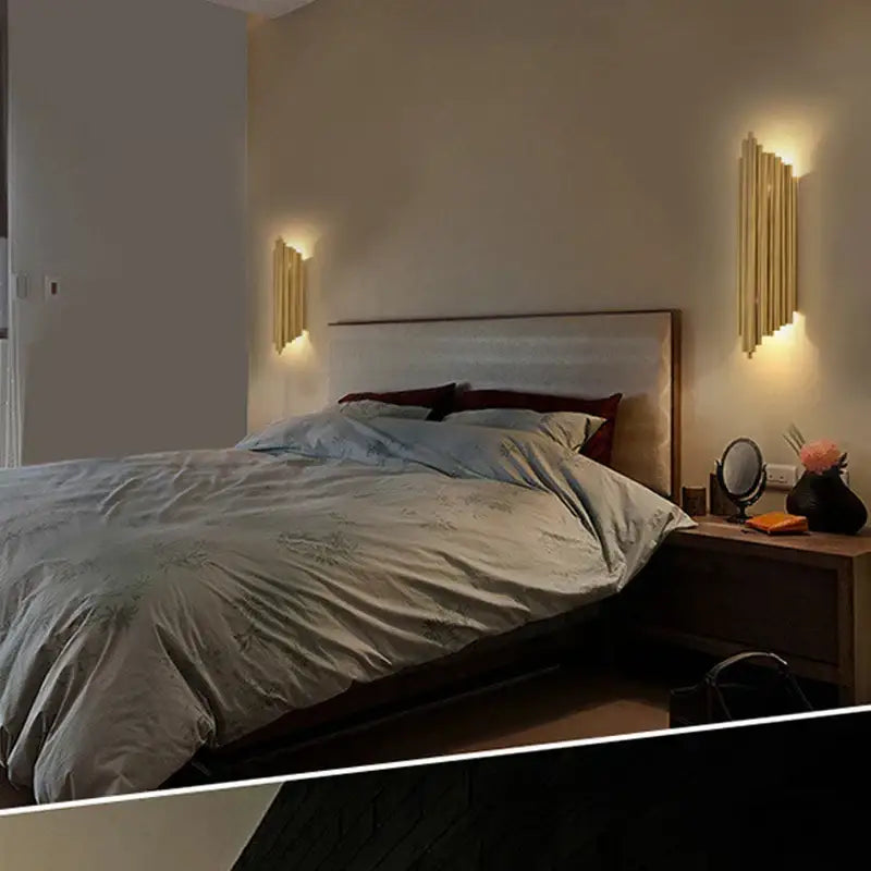 Modern golden led tube wall sconce with gold-toned vertical bars providing warm ambient lighting for living room decorbites decor