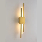 Modern golden led wall lamp with sleek cylindrical rods and square base for bedroom ambient lighting decorbites golden led