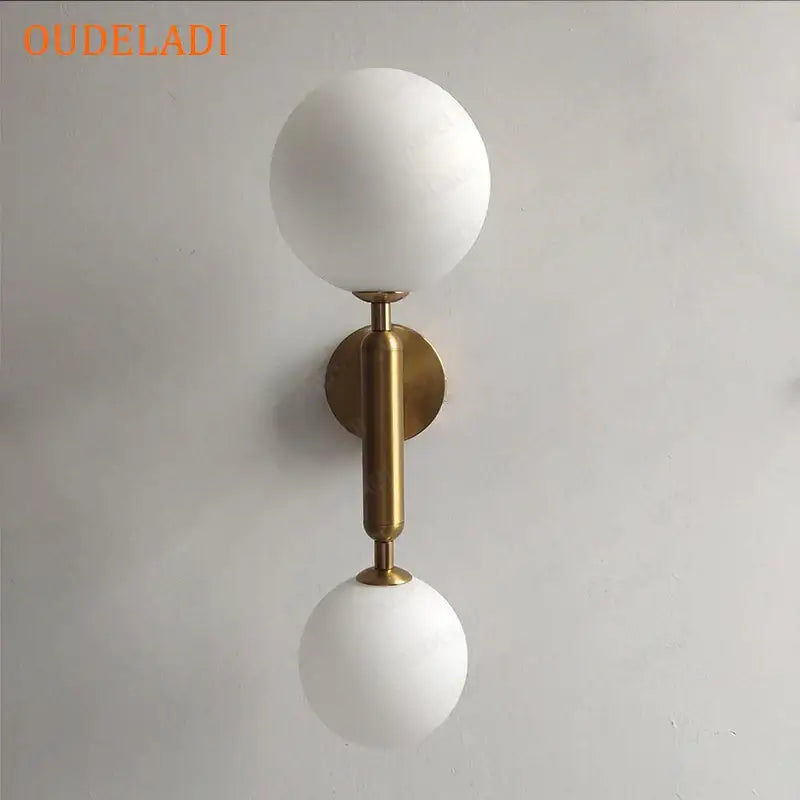 Modern golden led wall sconce with white frosted glass globe and brass stem by decorbites golden led for bedroom decor