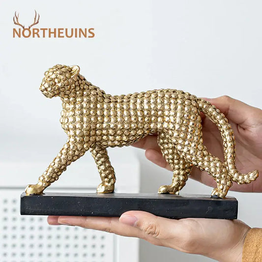 Modern golden leopard resin figurine with textured gemstone surface on sleek black base for living room decorbites golden leopard
