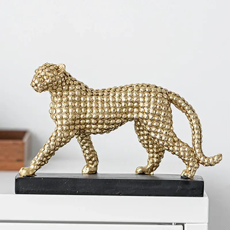 Modern golden leopard resin figurine with textured beaded surface on black base for living room decorbites golden leopard decor