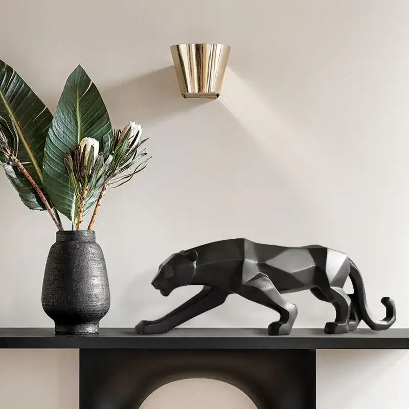 Black geometric panther figurine with metallic silver accents complementing decorbites golden leopard resin sculpture decor