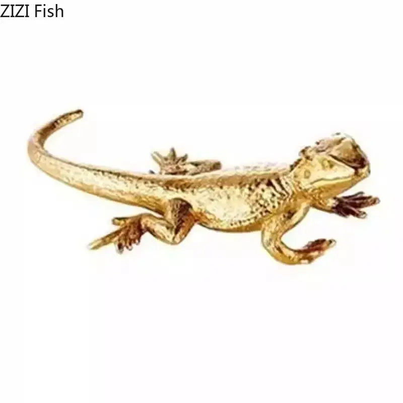 Golden lizard sculpture brooch with textured scales and detailed limbs metal ornament for modern living room desk