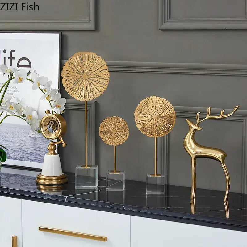 Modern golden lotus sculpture featuring a sleek golden deer figurine with polished finish and elegant antlers metal decor