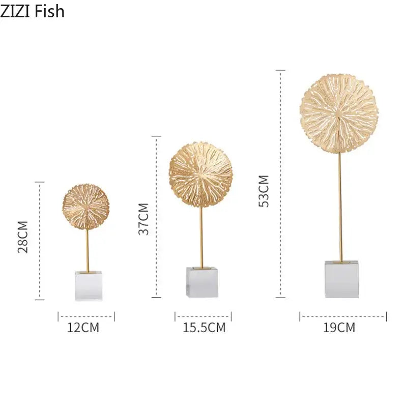 Modern golden lotus sculpture featuring gold-toned textured fish shapes on metal stems with white square bases for decor