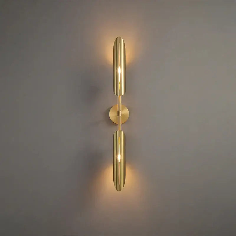 Modern golden metal led wall lamps featuring a gold-toned minimalist design with two cylindrical shades for decorbites decor