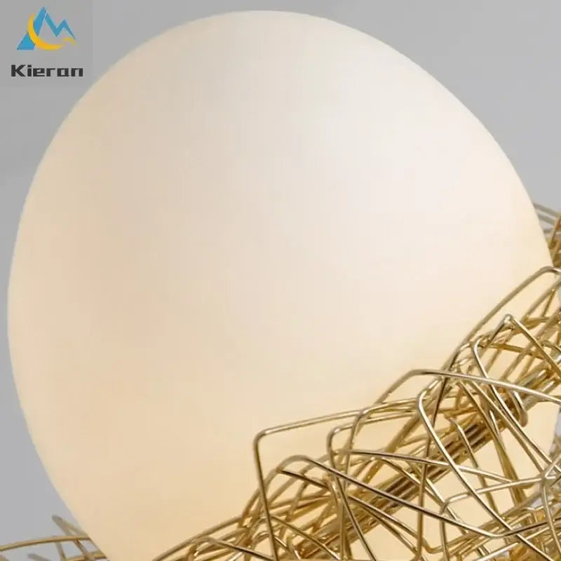 Modern golden nest glass led ceiling lamp with cream spherical lampshade and golden wireframe base for living room decor